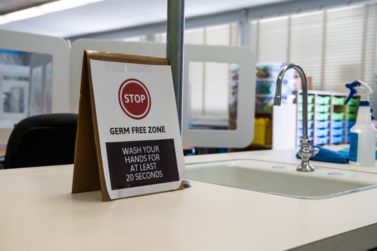 hand washing sign at a classroom sink